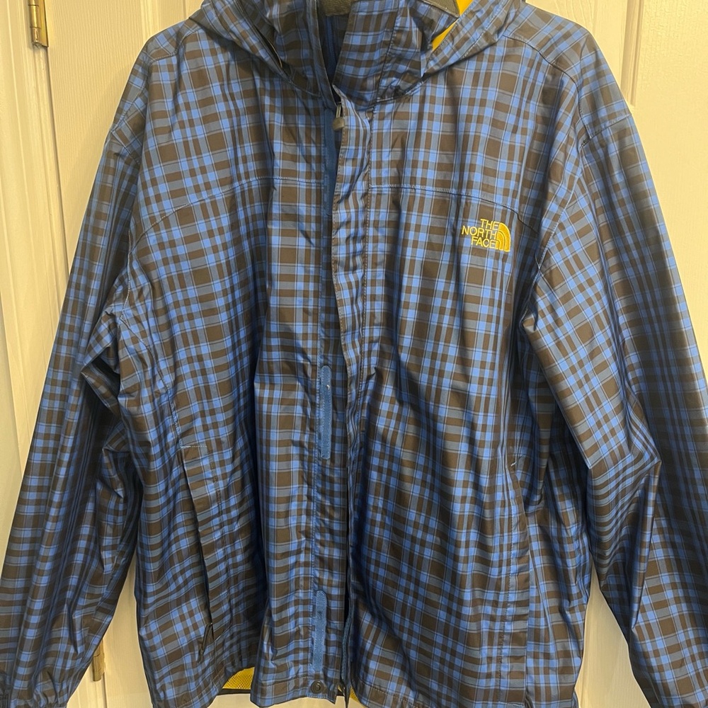 The North Face Blue and Black Plaid Kids Hooded Rain Jacket with Yellow Logo